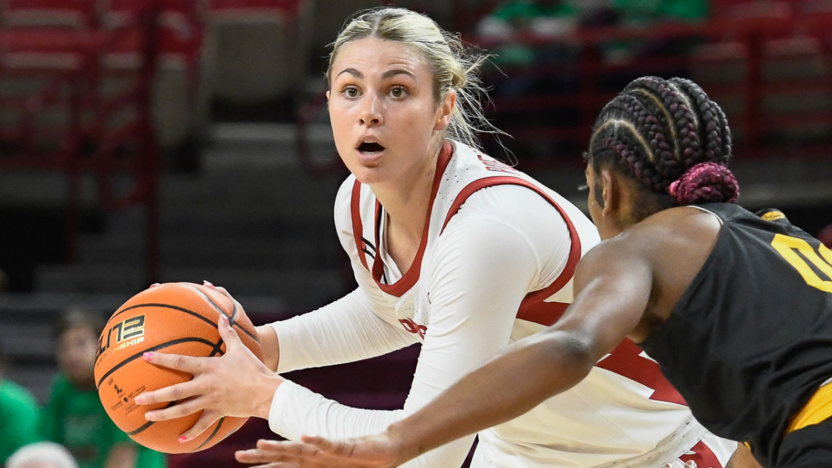 Razorbacks' Saylor Poffenbarger looks inside against UAPB on Sunday afternoon at Bud Walton Arena.